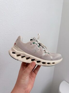 On Running Women's Running Shoe in Light Cream with Green Accents